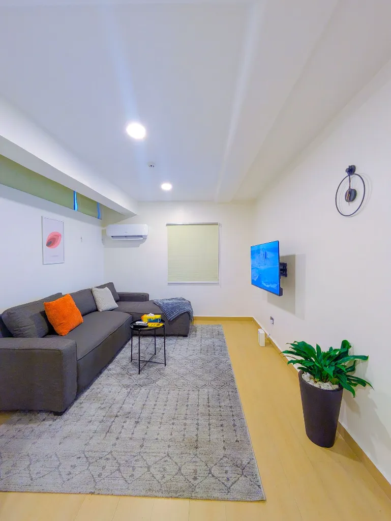 Room 206 Living room couch view.webp